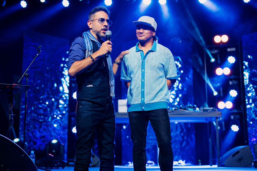 Sammy Taggett on stage at exclusive business events